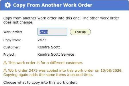 The warning that work order 2473 was copied into this work order on a given date